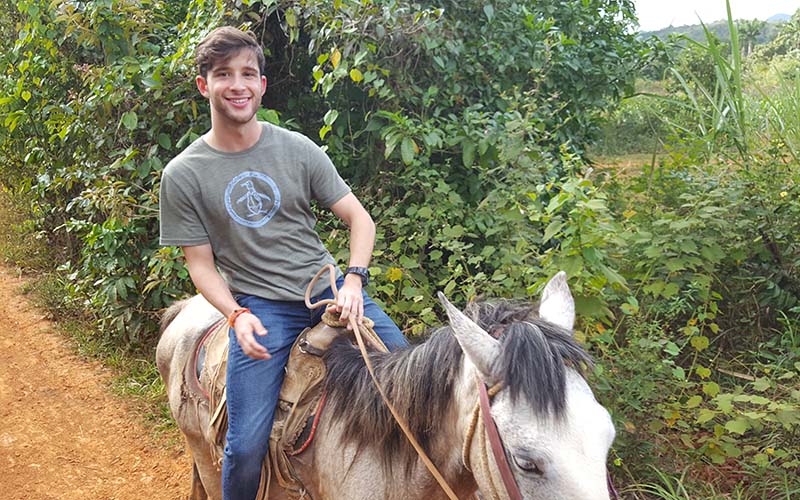 austin college student enjoying a horseback riding trip through las terrazas, an ecological community outside of havana. january 2019