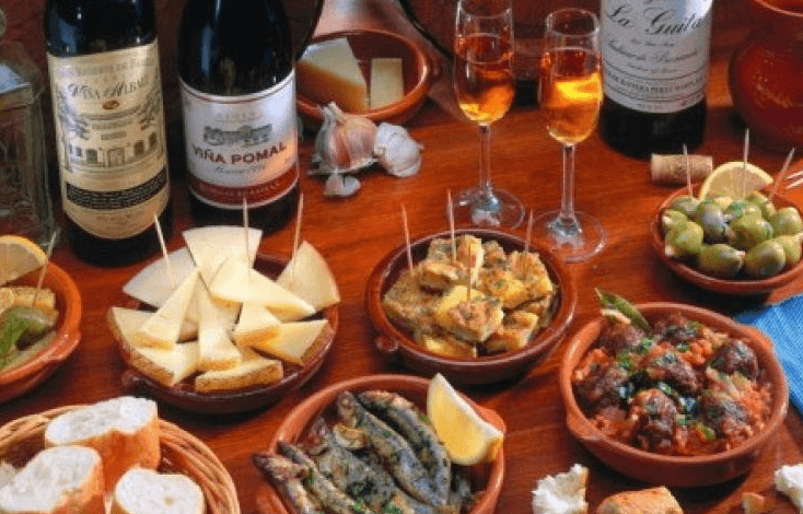 A delicious spread of Spanish tapas and beer in Seville