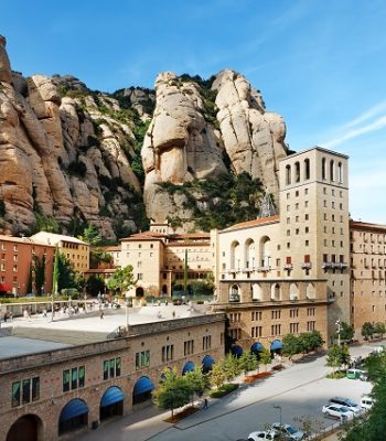 View of Montserrat Monastery. Beautiful Benedictine Abbey,  high in mountains.  Catalonia. Spain